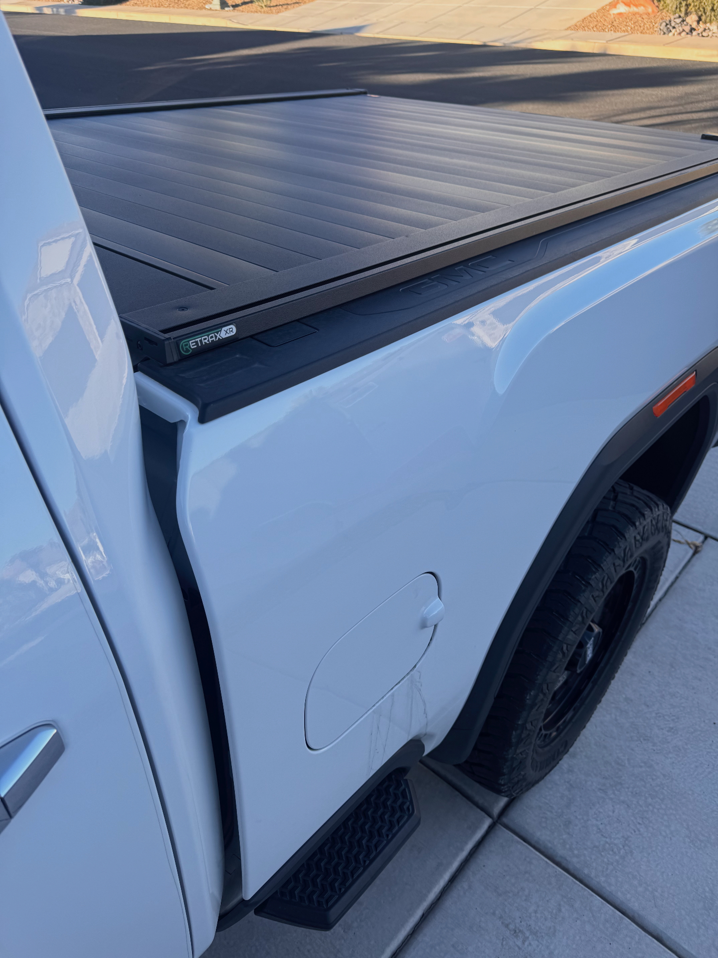 White GMC truck with Retrax retractable bed cover installed in Utah